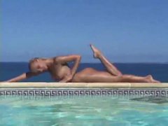 Cumshotti presents: Blonde strips from bikini and takes a dip