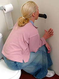 Cumshotti presents: Blonde girl Jamie sits on the toilet and blows a black gloryhole dong